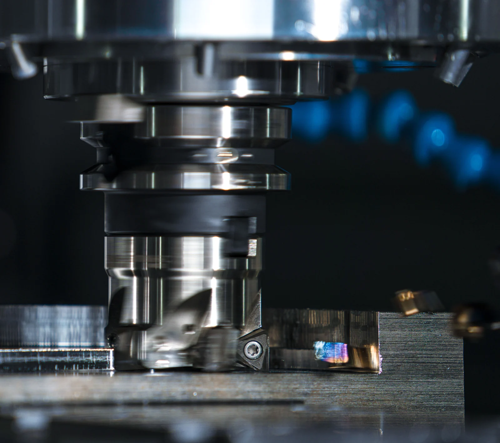 Milling cutter contacting a metal workpiece