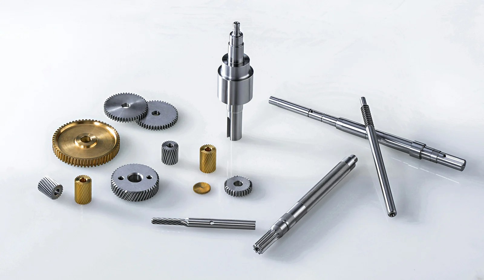 Machined shafts and gears on a light background