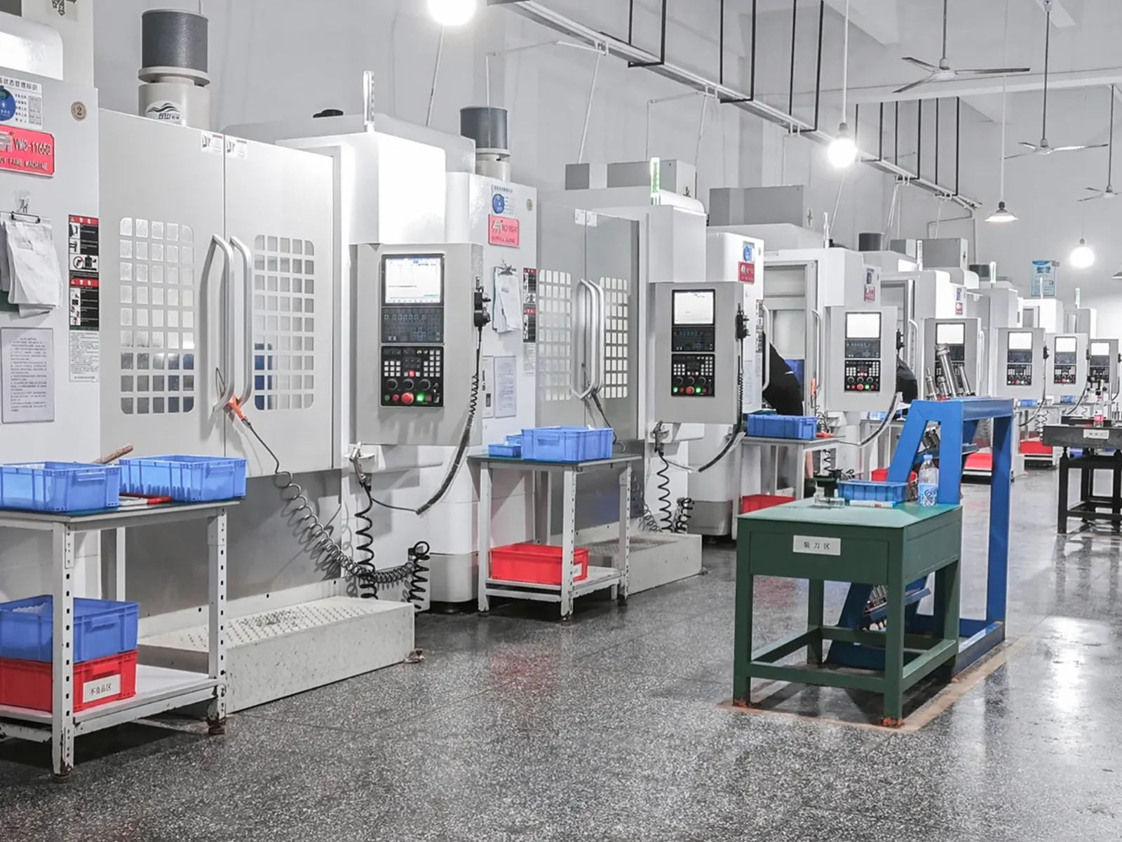 Clean row of five-axis machining equipment at an independent partner manufacturer