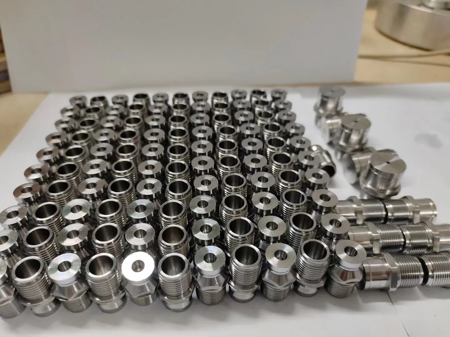 Custom threaded machined fittings and compact interface parts